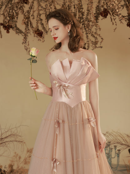 Elegant Blush Pink Strapless Tulle Ball Gown with Bow Accents - Harmony Gallery