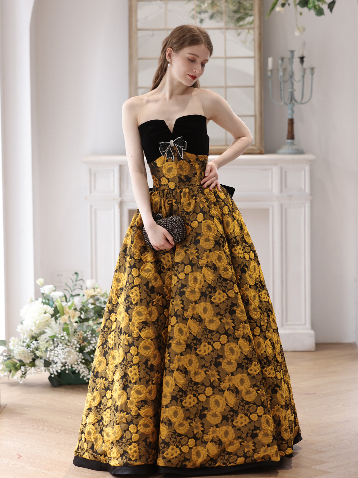 Elegant Black and Gold Floral Strapless Ball Gown with Bow Accent - Harmony Gallery