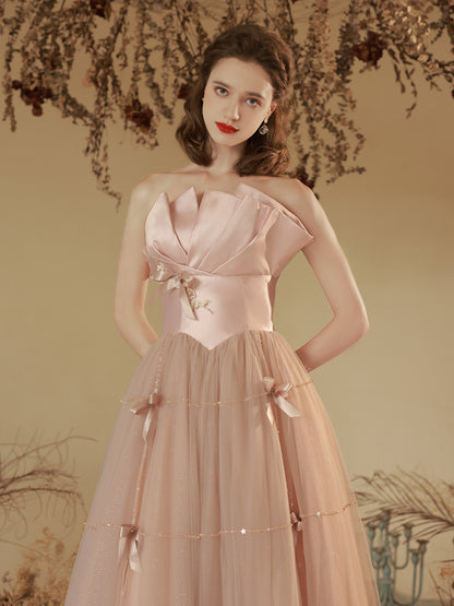 Elegant Blush Pink Strapless Tulle Ball Gown with Bow Accents - Harmony Gallery