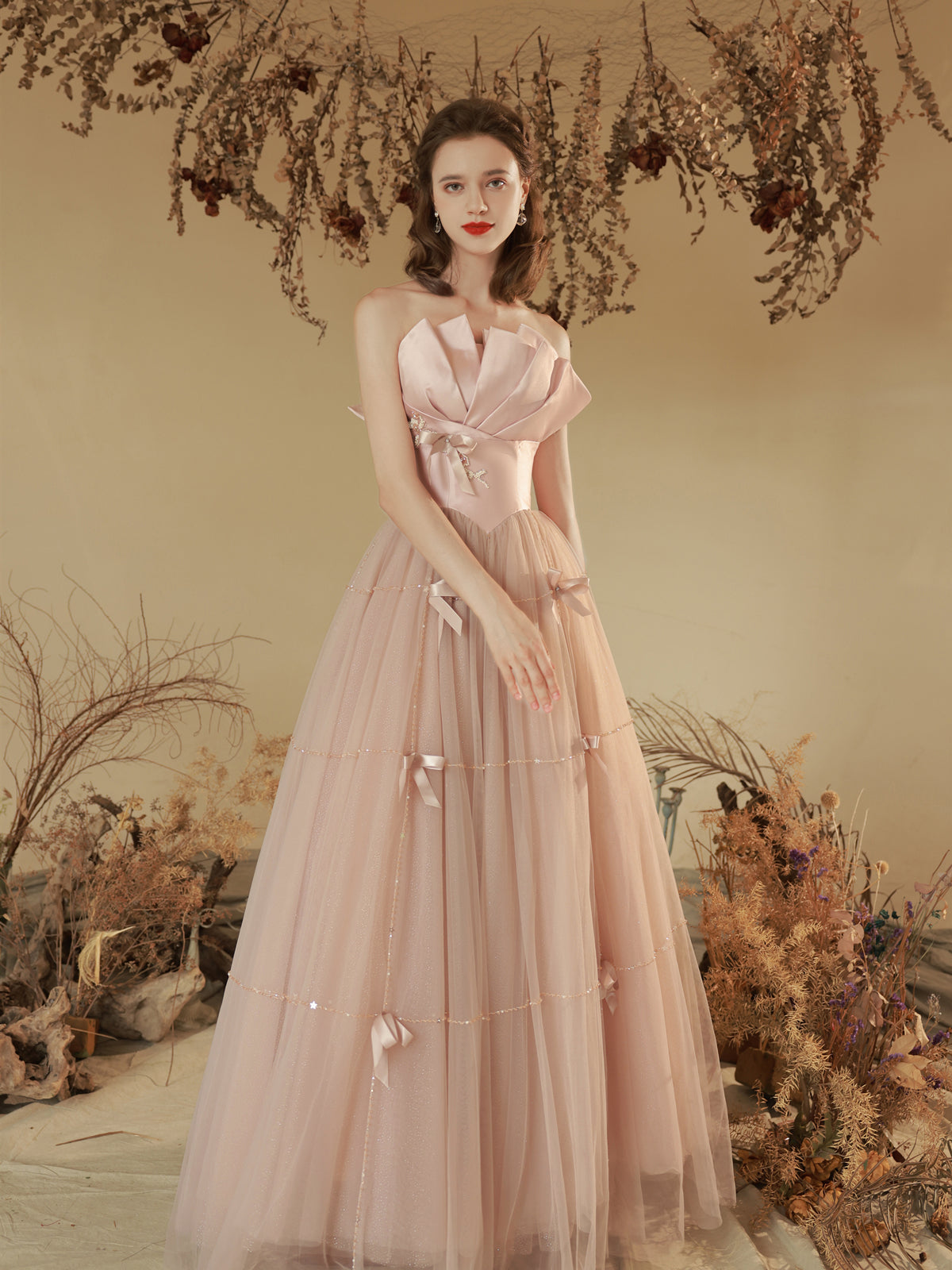 Elegant Blush Pink Strapless Tulle Ball Gown with Bow Accents - Harmony Gallery