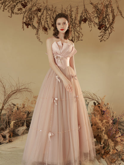 Elegant Blush Pink Strapless Tulle Ball Gown with Bow Accents - Harmony Gallery
