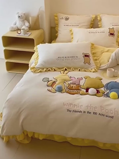 Simpatico set letto in quattro pezzi di Winnie the Pooh in puro cotone
